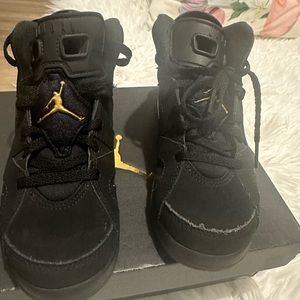 Jordan Retro 6 black and gold size 13c pre school